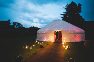 yurt at night with festoon walkway