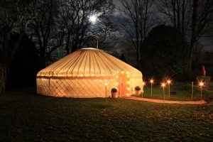 yurt at night with festoon walkway