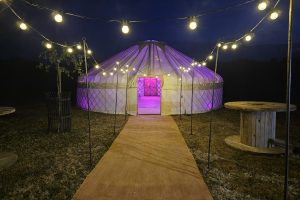 33ft yurt at night with walkway 2