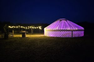 33ft yurt at night with walkway