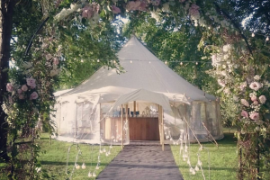 small marquee with floral archway